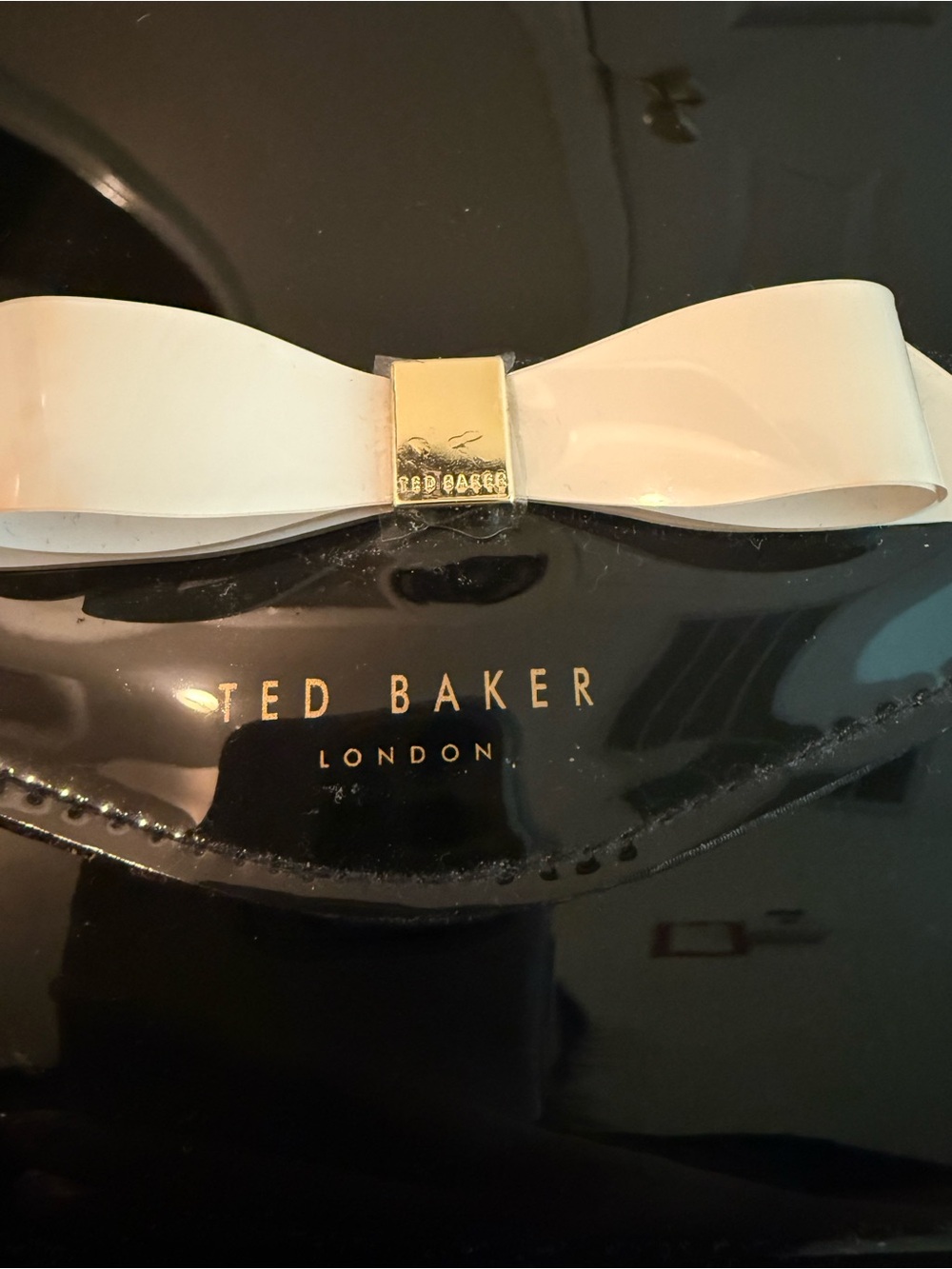 Ted Baker London Black Patent Clutch with White Bow Accent